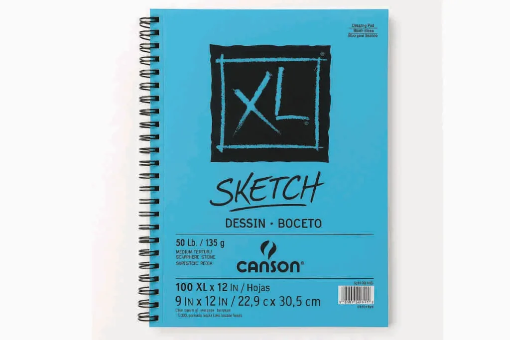 Canson XL Series Sketch Pad with turquoise-blue spiral cover, XL logo, and black text showing size and paper weight, displayed on white background