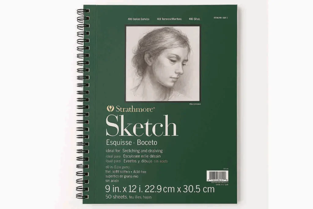 Strathmore 400 Series Sketch Pad with green spiral cover and pencil portrait, displayed on a clean white background