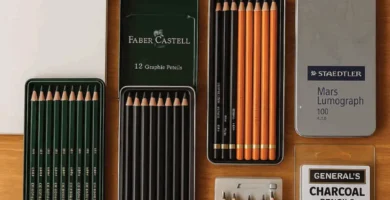 ,Top 5 drawing pencils for artists with accessories on a wooden desk